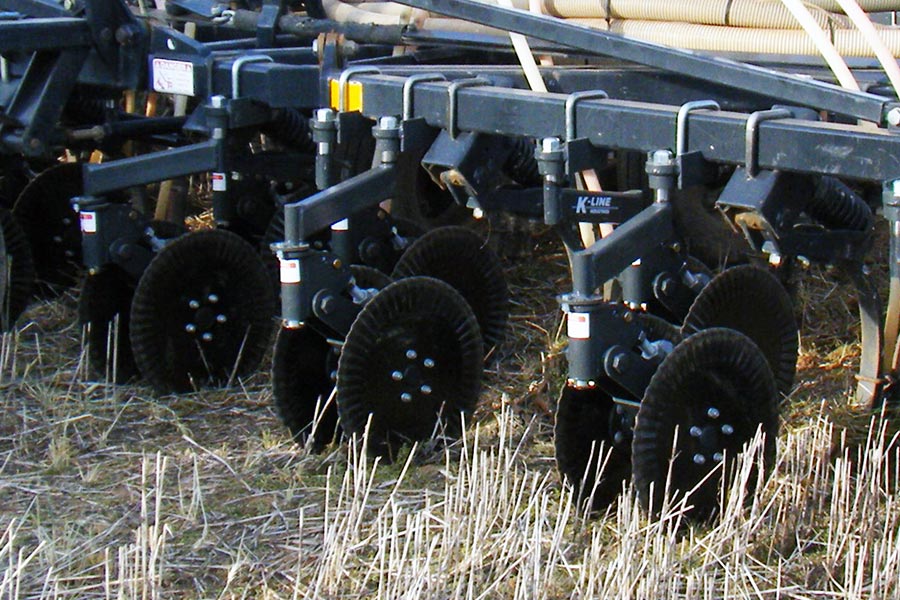 Coulters can help cut through residues, leaving clear rows ahead of the seeding mechanisms.